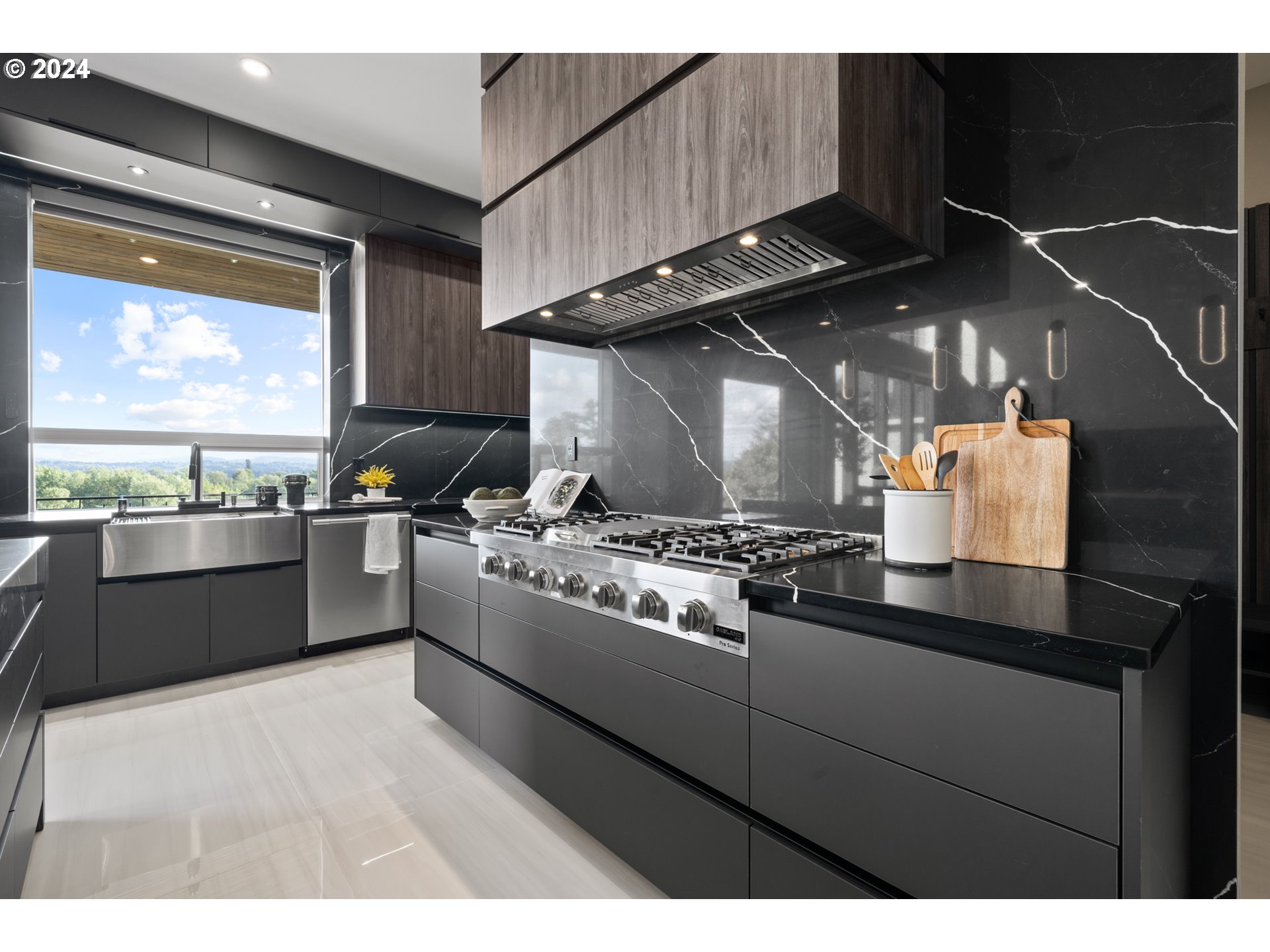 512 Province Drive Camas, WA 98607 - Photo 13 of 46 a kitchen with stainless steel appliances granite countertop a stove a sink and a refrigerator