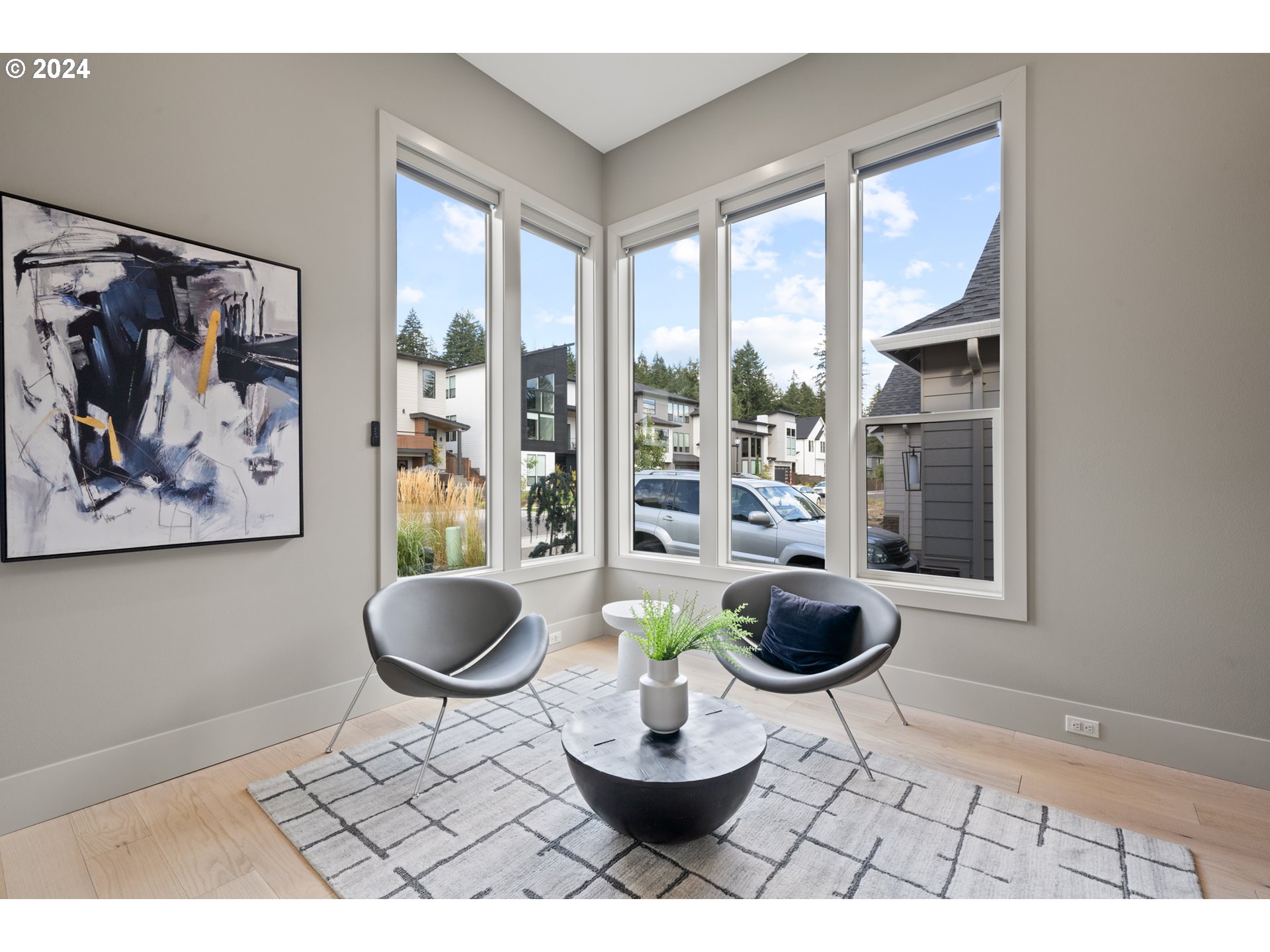 512 Province Drive Camas, WA 98607 - Photo 20 of 46 a room with a large window and a potted plant