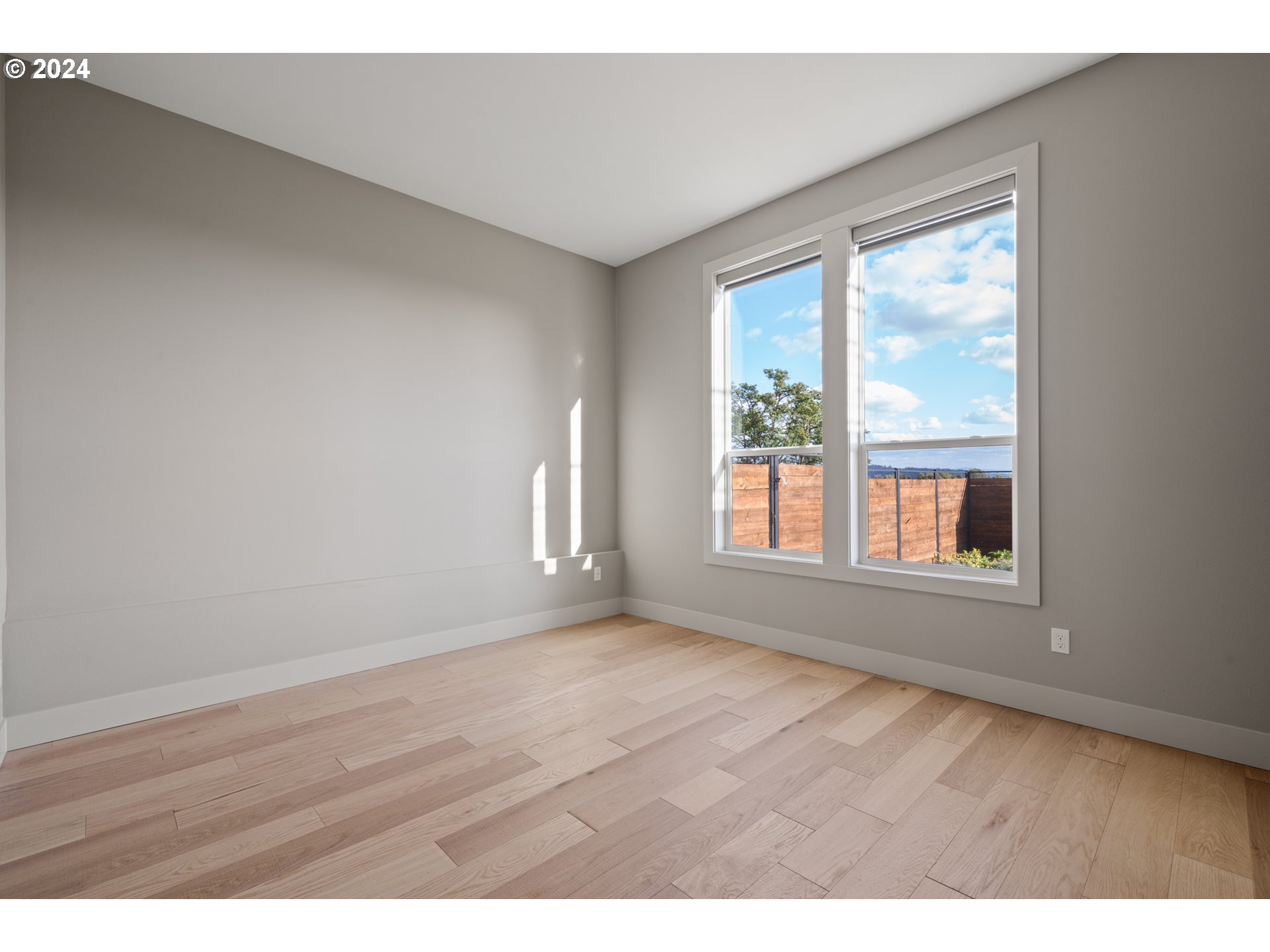 512 Province Drive Camas, WA 98607 - Photo 35 of 46 a view of an empty room with wooden floor and a window