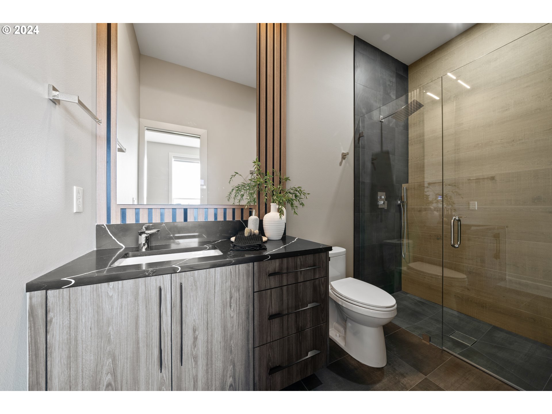 512 Province Drive Camas, WA 98607 - Photo 36 of 46 a bathroom with a sink a toilet a mirror and shower