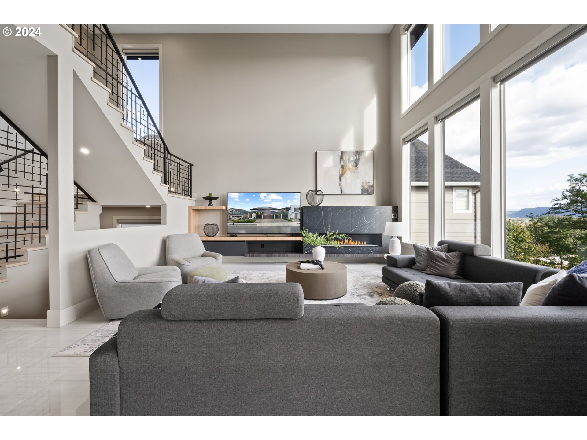 512 Province Drive Camas, WA 98607 - Photo 8 of 46 a living room with furniture a large window and a wooden floor