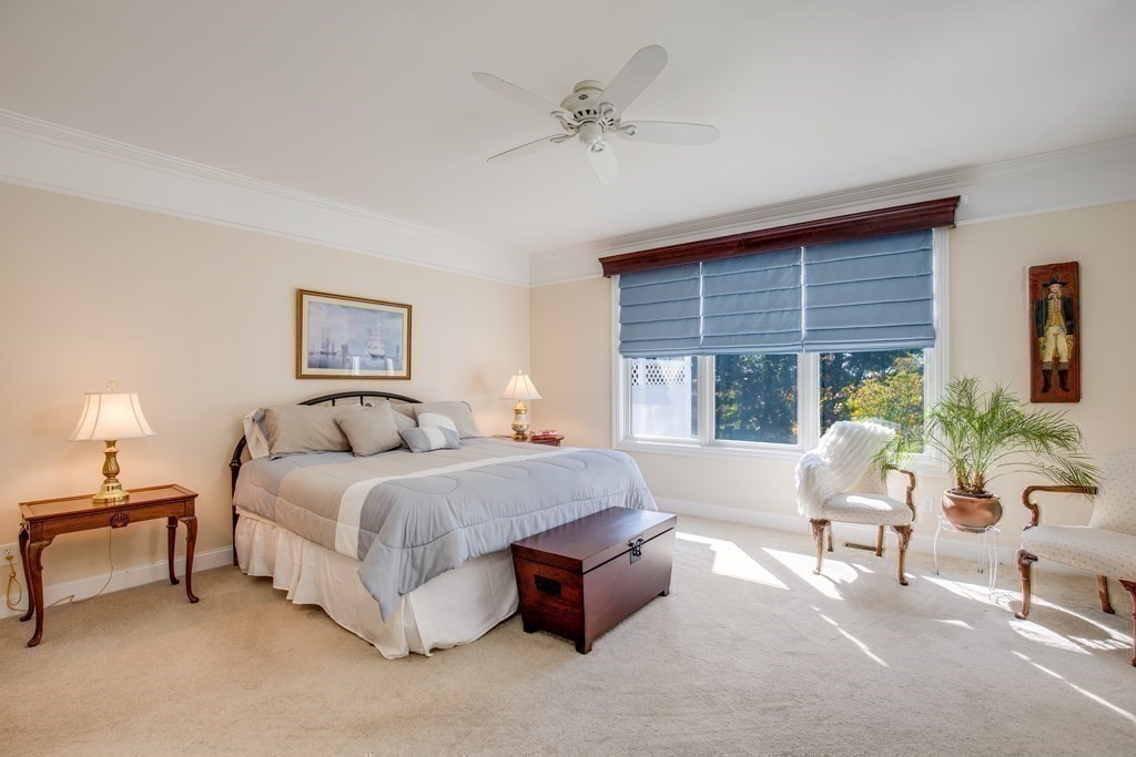 9 Riverview Heights, Unit 48 Amesbury, MA 01913 - Photo 12 of 37 a spacious bedroom with a bed and a window