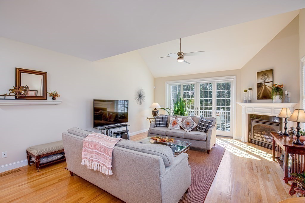 9 Riverview Heights, Unit 48 Amesbury, MA 01913 - Photo 3 of 37 a living room with furniture and a fireplace