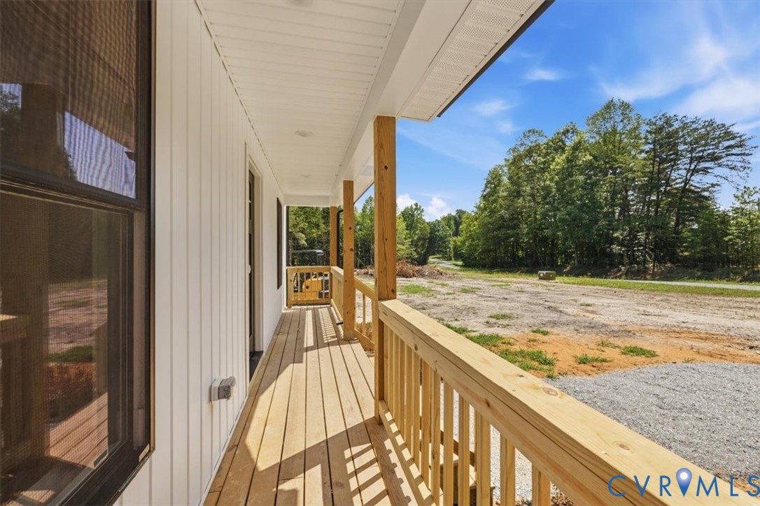 654 Frenchs Store Road Cumberland, VA 23040 - Photo 17 of 24 Front porch featuring natural wood flooring, wood