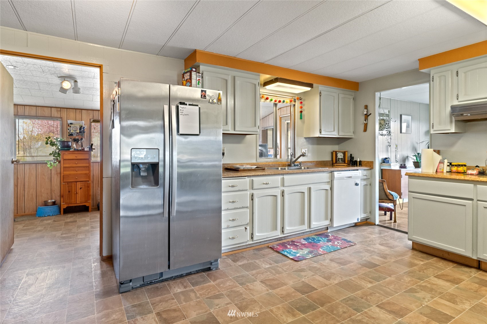 1 George Road Omak, WA 98841 - Photo 13 of 38 a kitchen with stainless steel appliances a refrigerator sink and cabinets