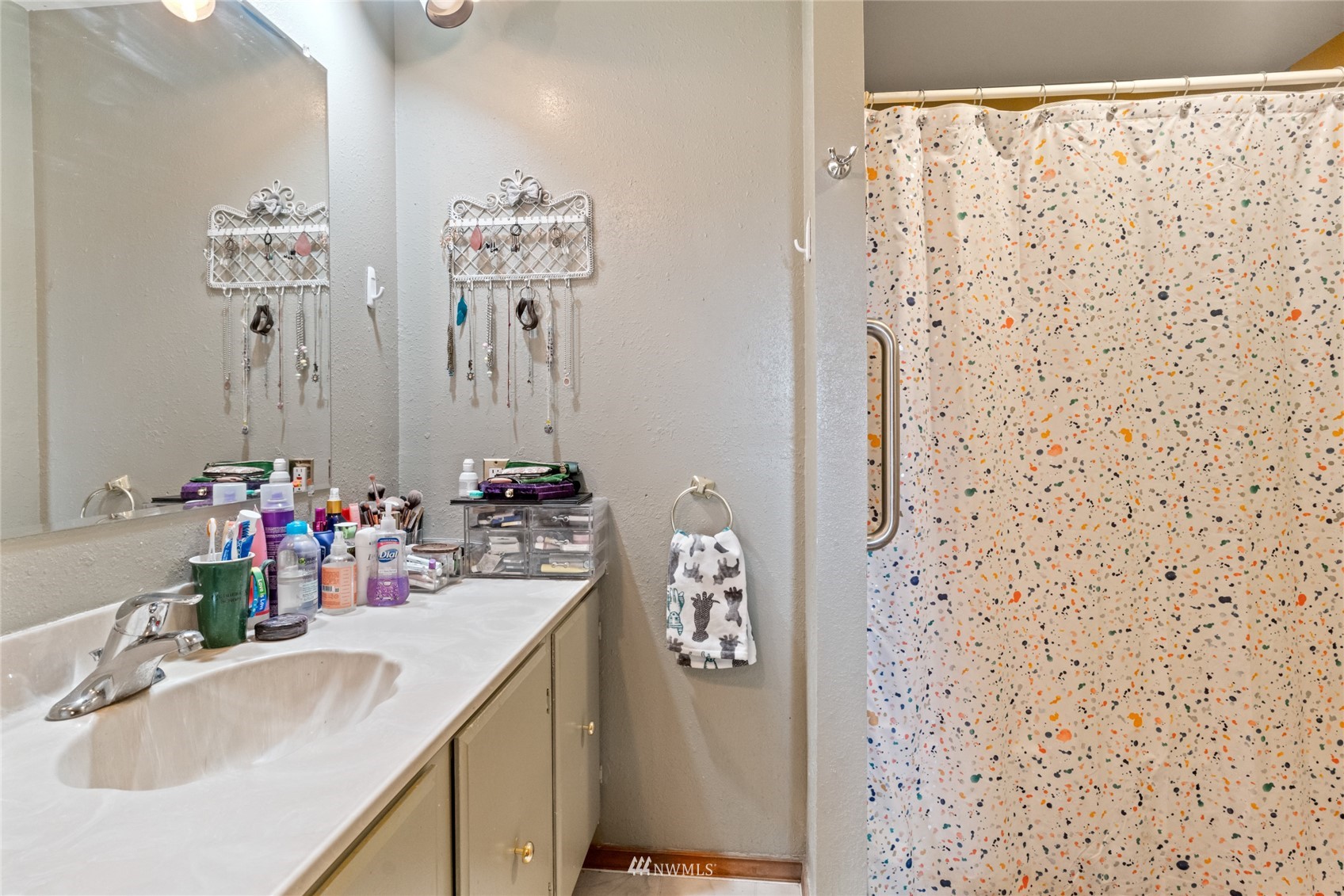 1 George Road Omak, WA 98841 - Photo 23 of 38 a bathroom with a sink mirror and shower