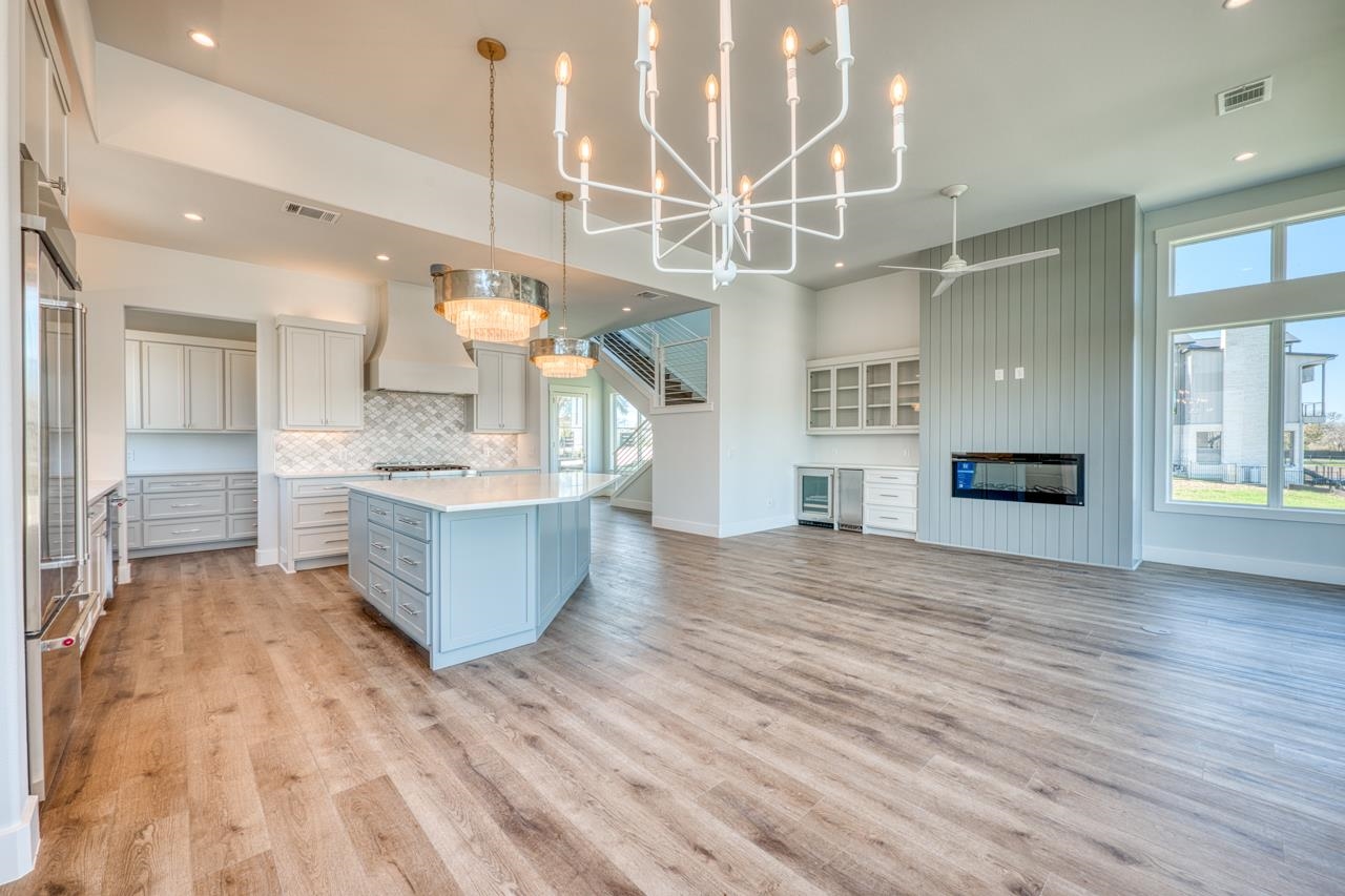 320 Lake Street Kingsland, TX 78639 - Photo 6 of 30 a large room with kitchen view and wooden floor