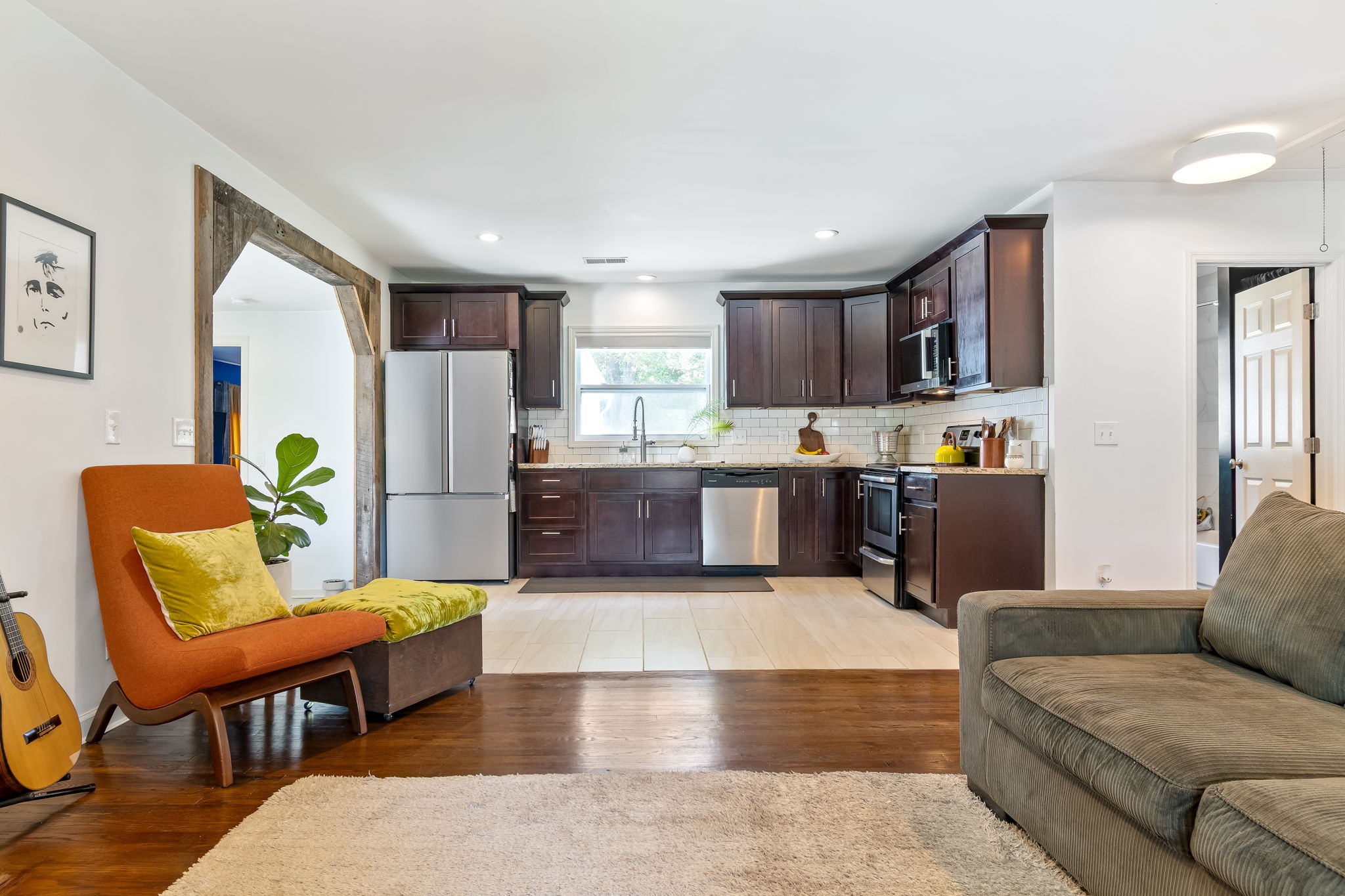 1136 Pierce Road Madison, TN 37115 - Photo 15 of 63 a living room with stainless steel appliances kitchen island granite countertop furniture and a couch