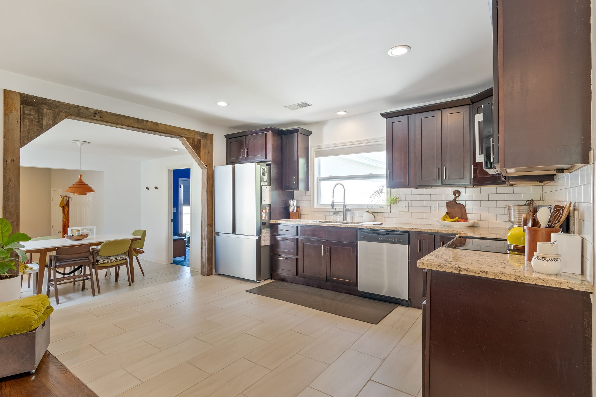 1136 Pierce Road Madison, TN 37115 - Photo 20 of 63 a kitchen with sink cabinets and dining table
