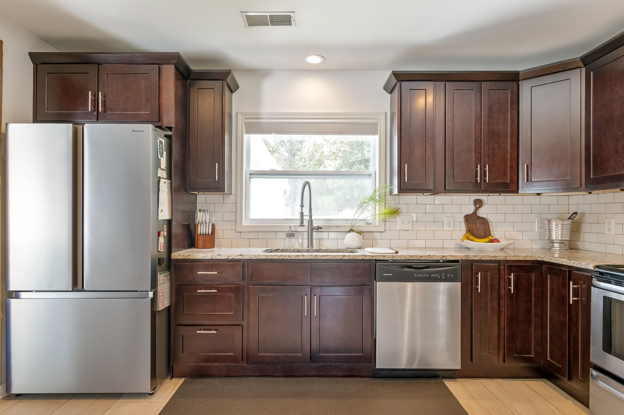 1136 Pierce Road Madison, TN 37115 - Photo 21 of 63 a kitchen with granite countertop a refrigerator stove top oven and sink