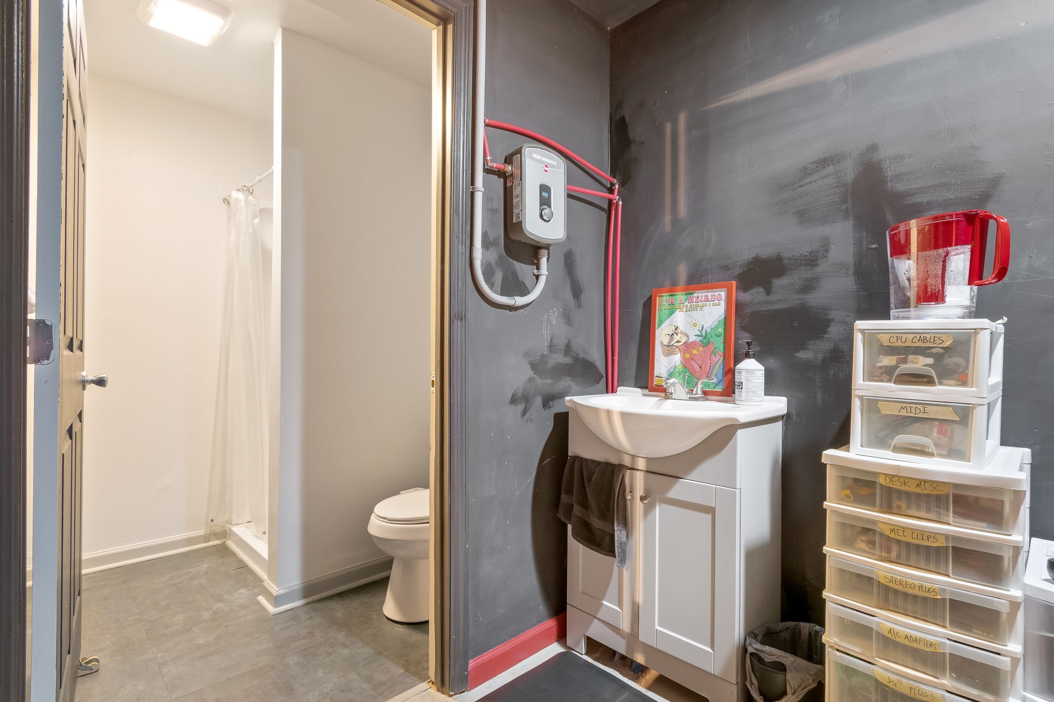 1136 Pierce Road Madison, TN 37115 - Photo 45 of 63 a bathroom with a sink a toilet and a mirror