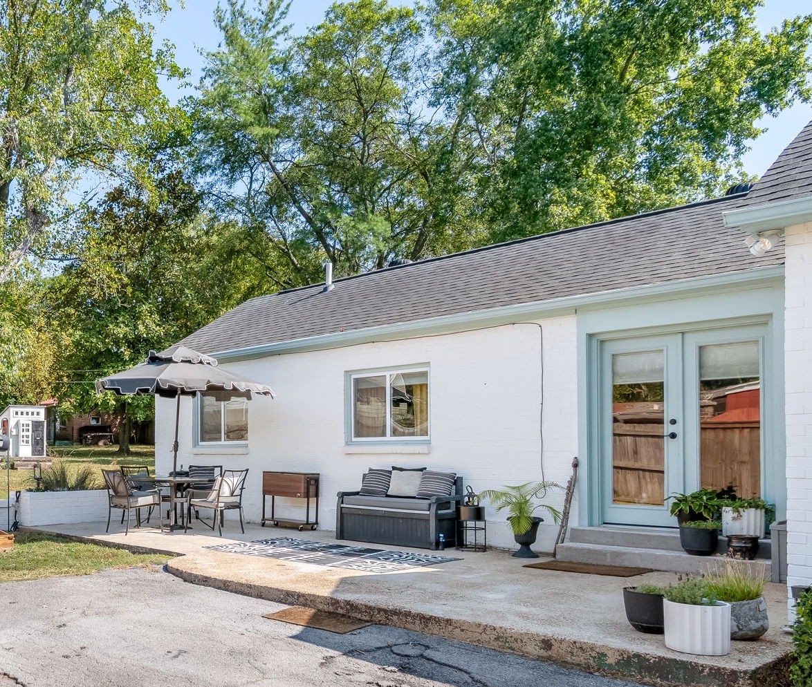1136 Pierce Road Madison, TN 37115 - Photo 48 of 63 a front view of a house with outdoor seating