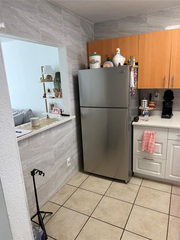 4745 Northwest 9th Drive, Unit 4745 Fort Lauderdale, FL 33317 - Photo 3 of 15 a room with a cabinets and washer dryer