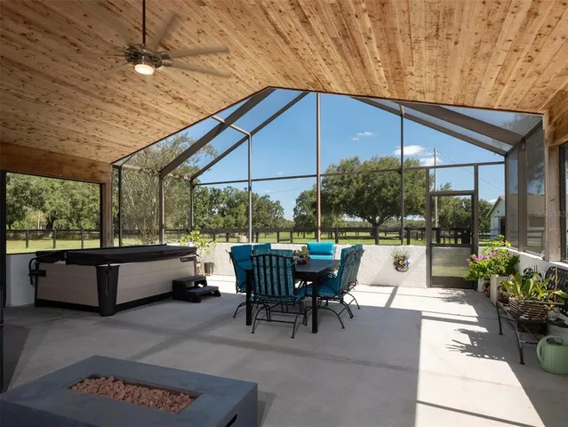 a patio with yard table and chairs