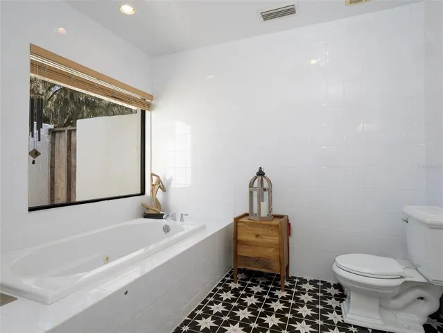 a bathroom with a toilet a sink and a bathtub