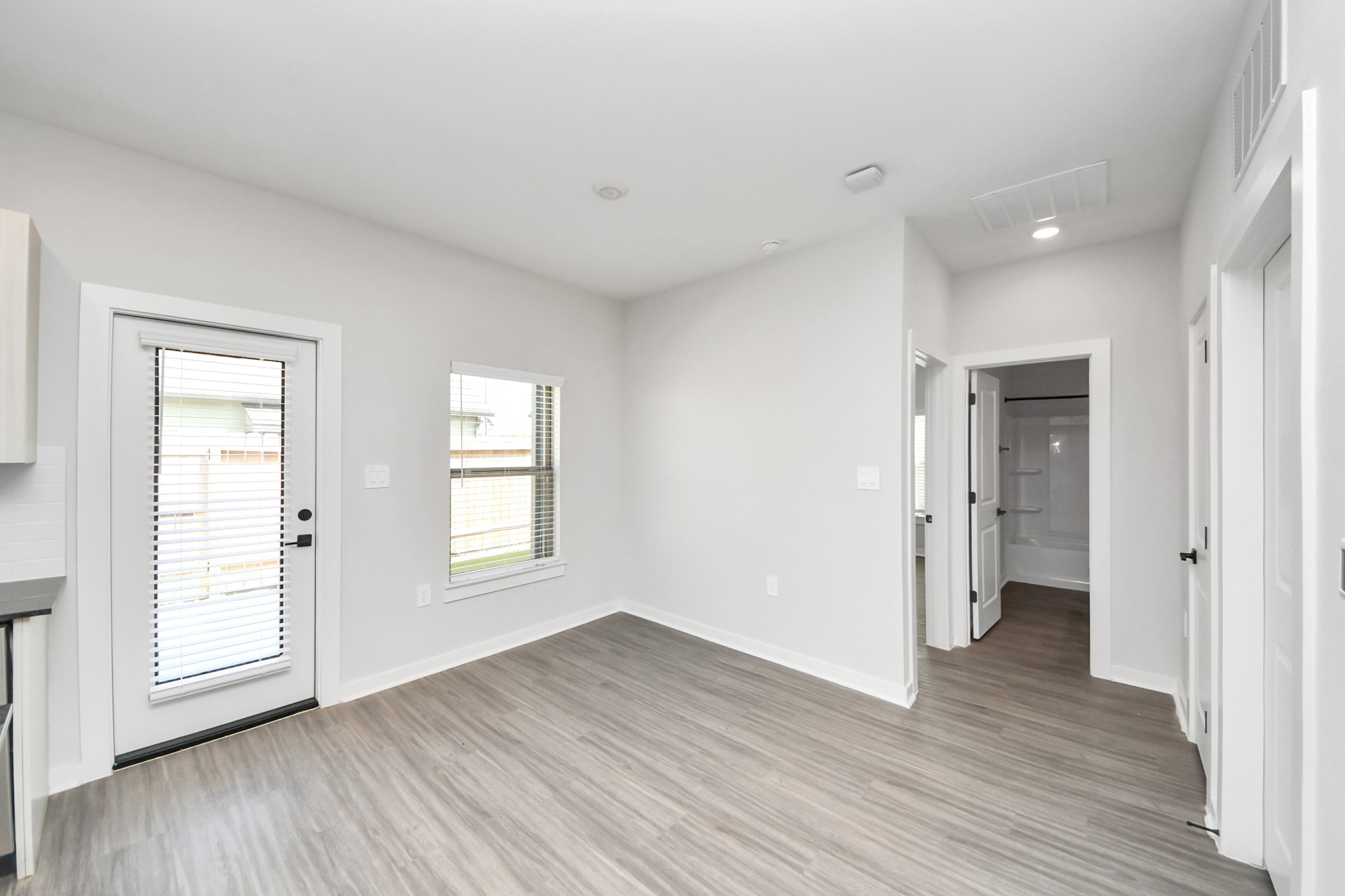 7711 Longmire Road, Unit 5 Conroe, TX 77304 - Photo 47 of 48 Open Concept Floor Plan with wood-like floors throughout!