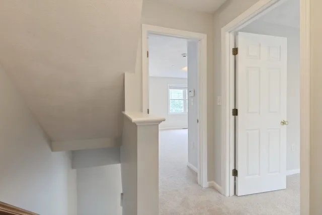 an empty room with a bathroom and a sink