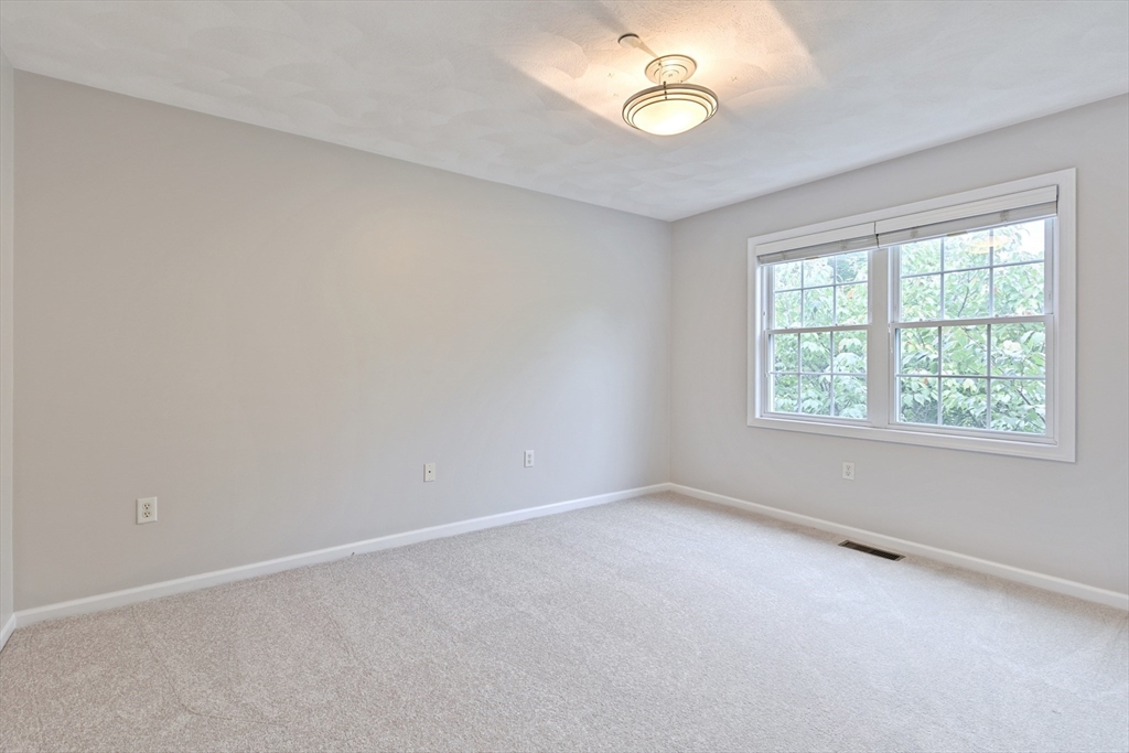 555 Main Street, Unit 10 Woburn, MA 01801 - Photo 22 of 39 an empty room with a window