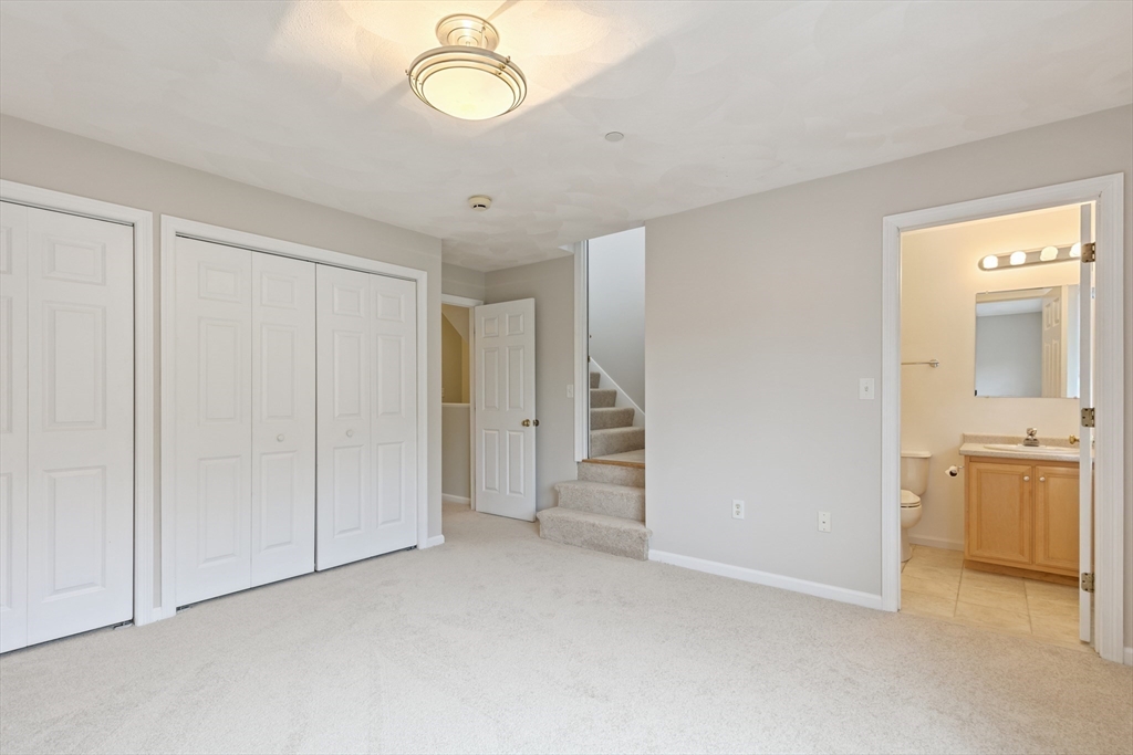 555 Main Street, Unit 10 Woburn, MA 01801 - Photo 23 of 39 an empty room with a bathroom and a sink