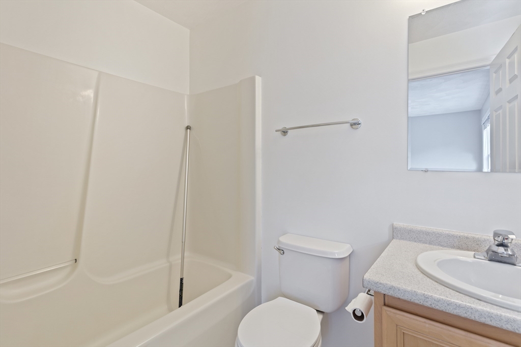 555 Main Street, Unit 10 Woburn, MA 01801 - Photo 26 of 39 a bathroom with a sink toilet and shower