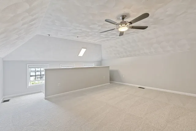 a view of entryway and kitchen