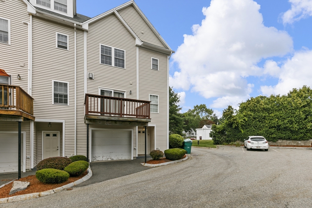 555 Main Street, Unit 10 Woburn, MA 01801 - Photo 3 of 39 a house view with a outdoor space