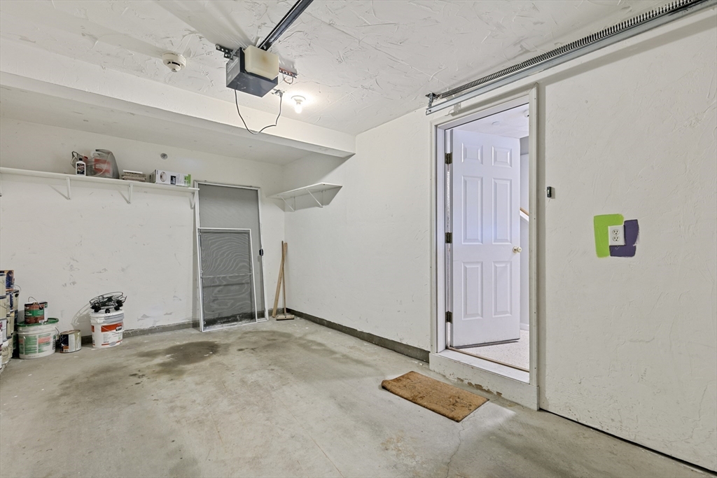 555 Main Street, Unit 10 Woburn, MA 01801 - Photo 32 of 39 a view of a livingroom with wooden floor and a ceiling fan