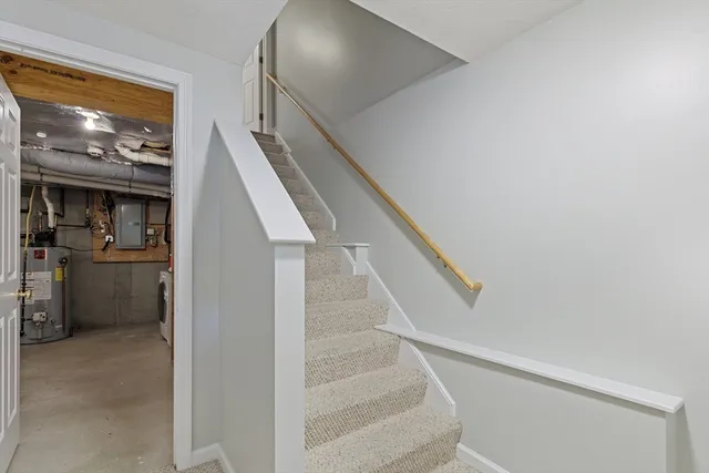 a view of a porch with a door and wooden floor