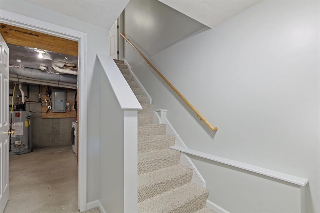555 Main Street, Unit 10 Woburn, MA 01801 - Photo 33 of 39 a view of entryway and kitchen