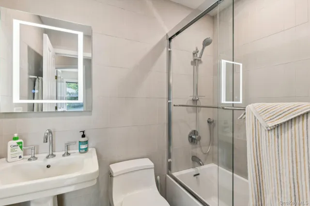 a bedroom with two beds and a large window