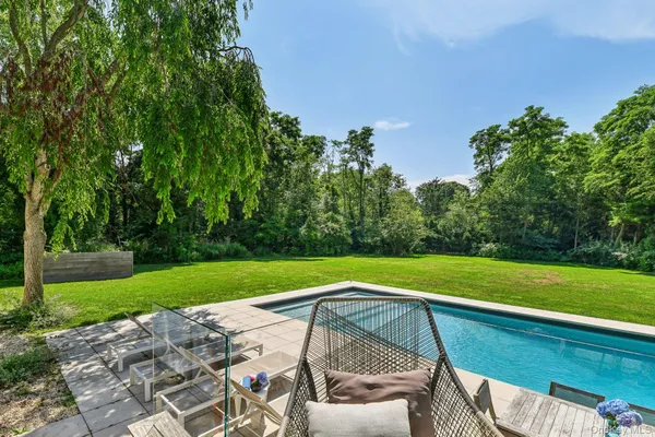 a view of a yard with a table and a chair