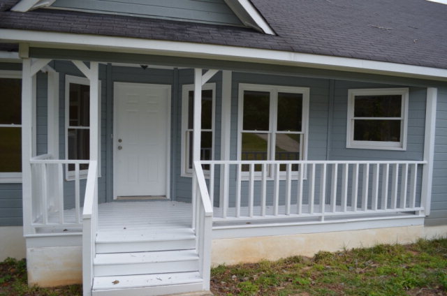 1689 Johnson Road Macon, GA 31220 - Photo 11 of 17 front view of a house with a porch