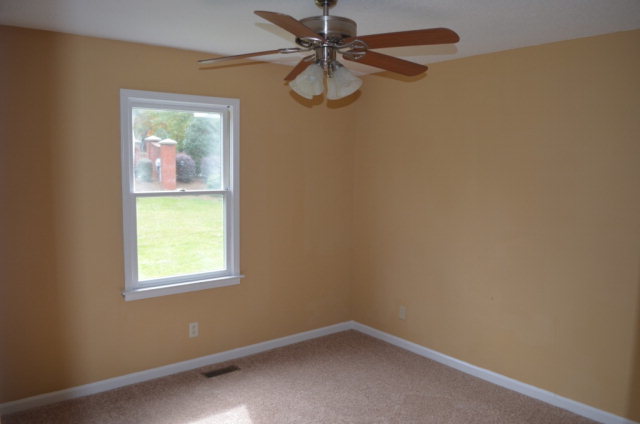 1689 Johnson Road Macon, GA 31220 - Photo 12 of 17 an empty room with windows and fan