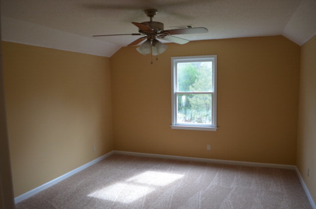1689 Johnson Road Macon, GA 31220 - Photo 14 of 17 an empty room with a window and a fan