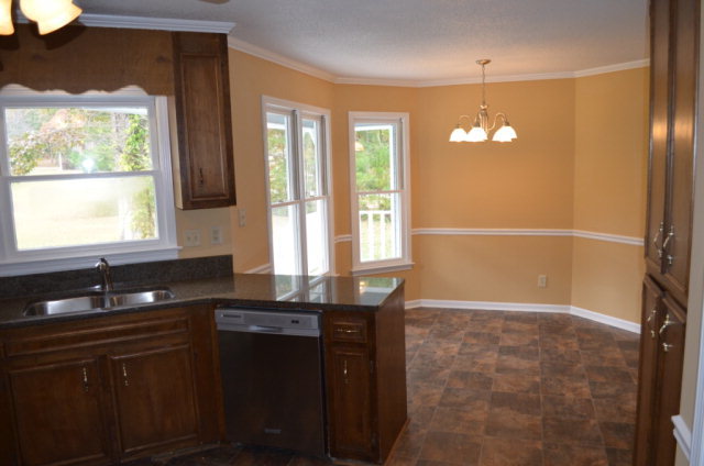 1689 Johnson Road Macon, GA 31220 - Photo 15 of 17 a view of a kitchen cabinets and chandelier