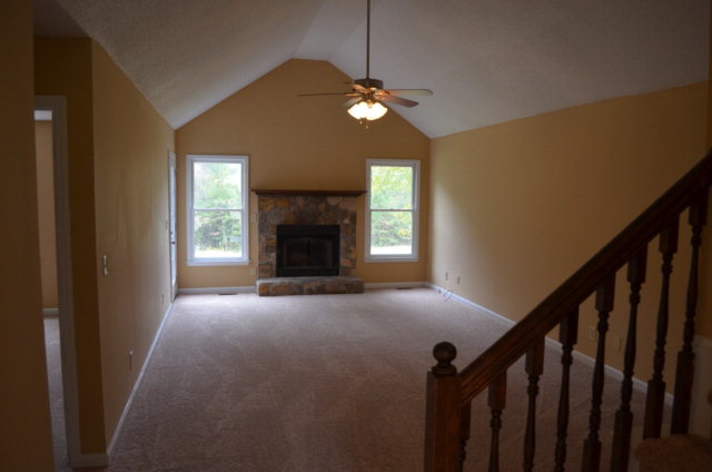 1689 Johnson Road Macon, GA 31220 - Photo 4 of 17 a view of empty room with fireplace and fan