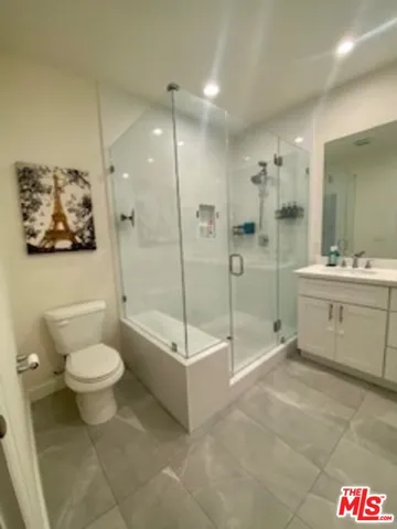 a bathroom with a sink a toilet and a bathtub