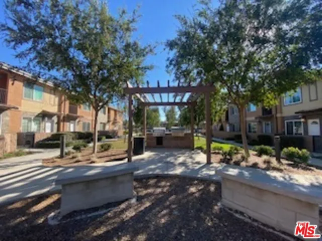 a view of a building with sitting area