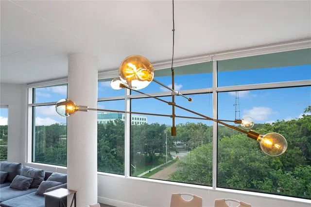 a view of a chairs and table in the balcony