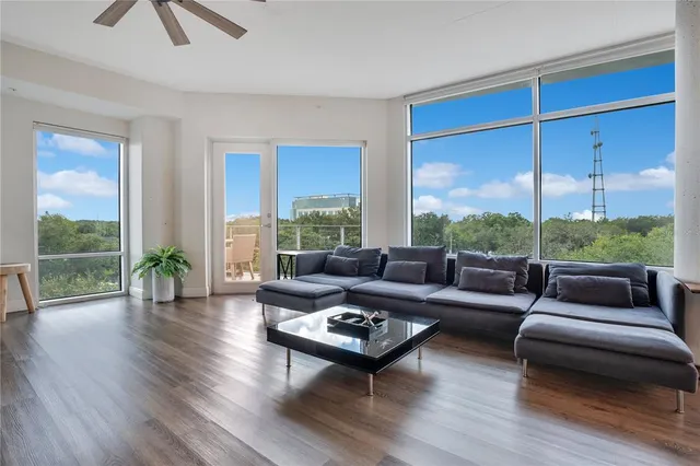 a living room with furniture and a large window