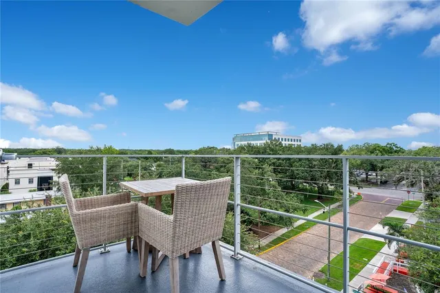 a bedroom with a bed and a flat tv screen