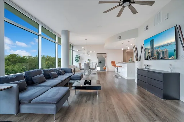 a spacious bathroom with a granite countertop sink mirror and toilet