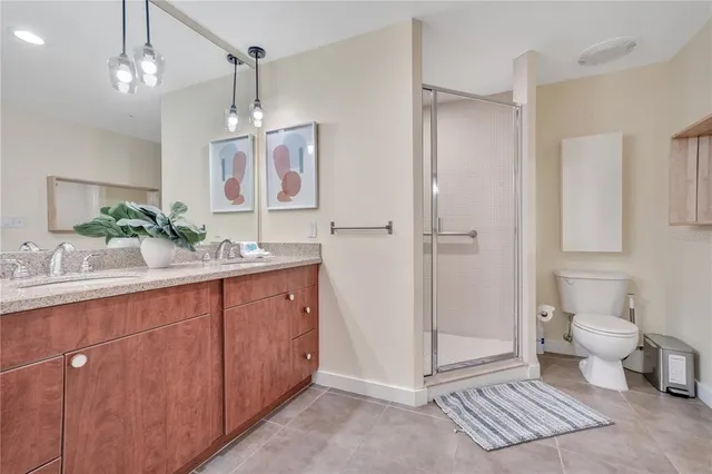 a bedroom with a sink and a mirror