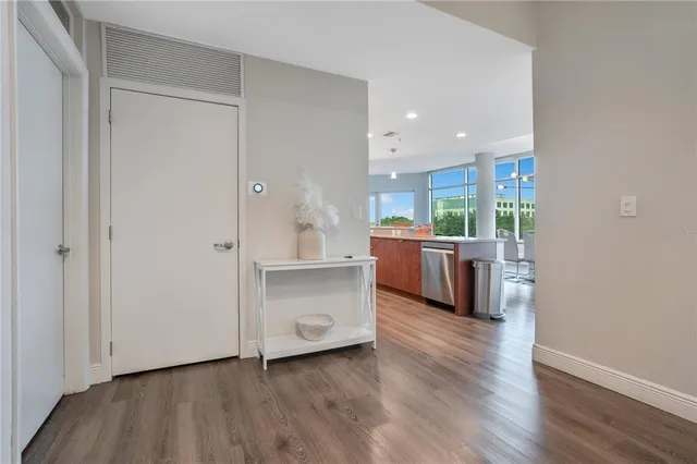 a kitchen with stainless steel appliances granite countertop a refrigerator a stove top oven a sink and dishwasher