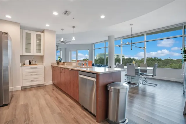 a view of water heater room with wooden floor