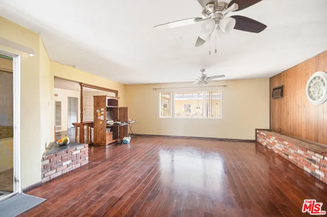 a view of livingroom with hardwood floor and workspace