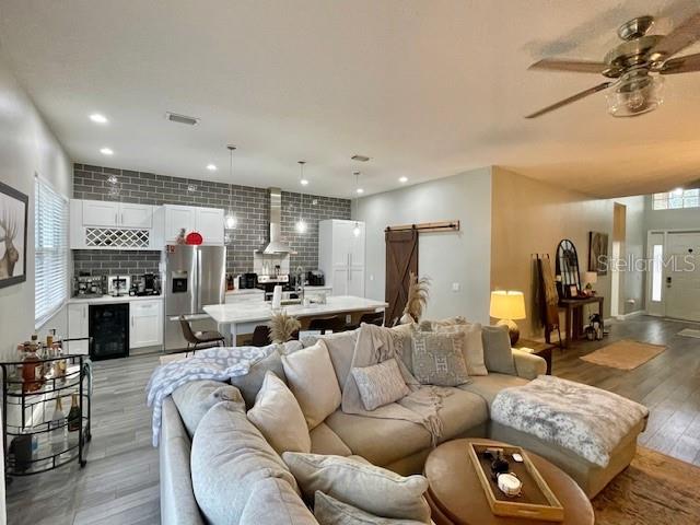 226 River Village Drive DeBary, FL 32713 - Photo 12 of 27 a living room with furniture kitchen view and a fireplace
