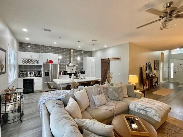 226 River Village Drive DeBary, FL 32713 - Photo 13 of 27 a living room with furniture kitchen and a fireplace