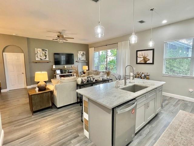 226 River Village Drive DeBary, FL 32713 - Photo 15 of 27 a view of kitchen island a sink and living room