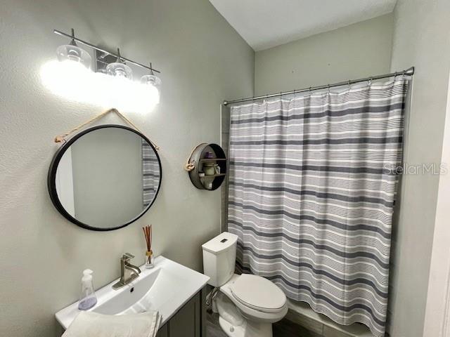 226 River Village Drive DeBary, FL 32713 - Photo 16 of 27 a bathroom with a sink a mirror and a toilet